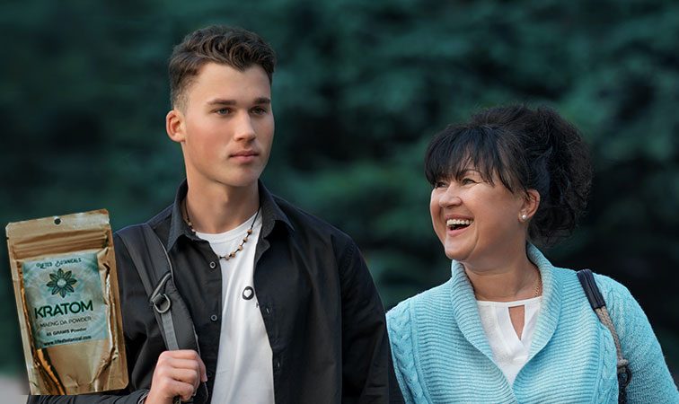 from left to right, kratom, son and mother smiling with trees behind them